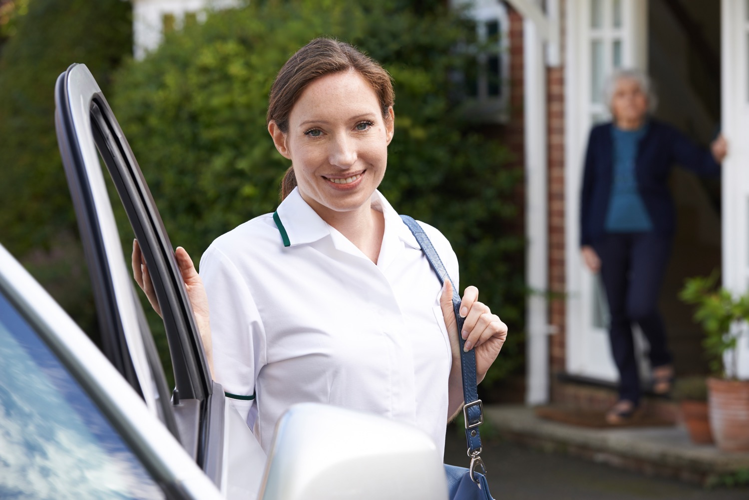 A caregiver arrives to drive her senior client to an appointment as part of a transportation service for seniors.